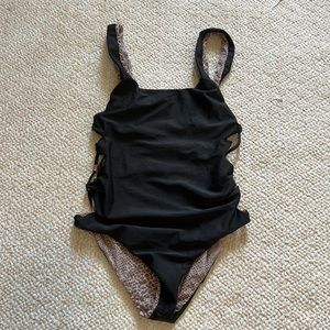 Acacia one piece in black size small. In good condition.
